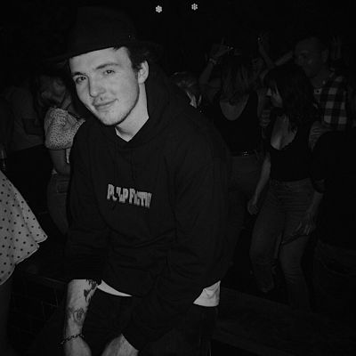 Ryland Lynch taking a picture wearing a Lynch Hoodie.